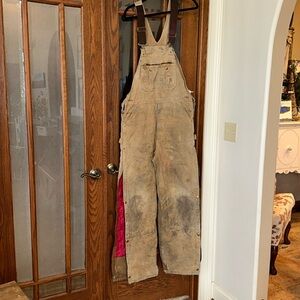 Distressed vintage Carhartt bibs